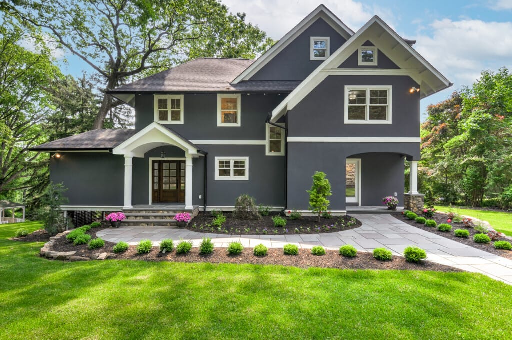 Restored historic home front exterior in Morris County NJ with updated landscaping and classic architectural details