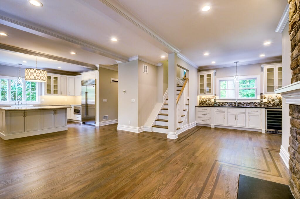 Open concept kitchen and living space in Morris County NJ with hardwood floors, custom cabinetry, and spacious layout
